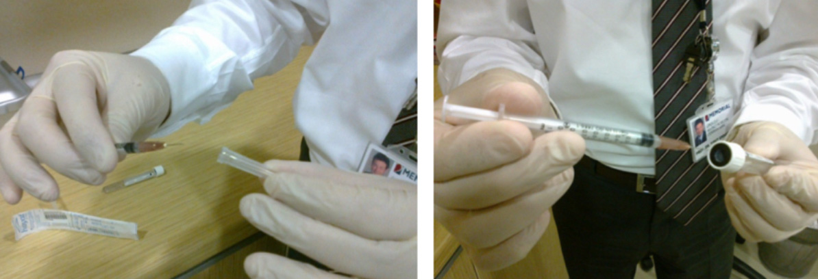 Figure 5: Remove the syringe cap and insert the needle vertically into the cleaned rubber stopper without touching it to any other surface.